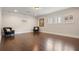 Expansive bonus room with hardwood floors, plantation shutters, recessed lighting, and ample space for activities at 9454 Becker Ct, Orlando, FL 32827