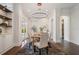 Elegant dining room with modern chandelier and views of the patio at 9454 Becker Ct, Orlando, FL 32827