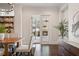 Sunlit dining area with view to outdoor fireplace and access to patio at 9454 Becker Ct, Orlando, FL 32827