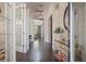 Stunning foyer with hardwood floors, a console table, and view to french doors leading to backyard at 9454 Becker Ct, Orlando, FL 32827