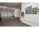 Spacious three car garage with modern EV charger and ample storage space at 9454 Becker Ct, Orlando, FL 32827