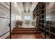 A bright home office with custom built-in shelving, library ladder, wood floors, and a comfortable seating area at 9454 Becker Ct, Orlando, FL 32827