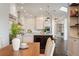 Bright kitchen featuring white cabinets, marble backsplash, stainless steel appliances, and pendant lighting at 9454 Becker Ct, Orlando, FL 32827