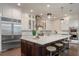 Modern kitchen featuring a large island, stainless steel appliances, and stylish pendant lighting at 9454 Becker Ct, Orlando, FL 32827
