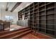 Library with an extensive built-in bookcase, ladder, and hardwood floors at 9454 Becker Ct, Orlando, FL 32827