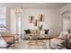 Inviting living room with stylish decor and natural light from large windows at 9454 Becker Ct, Orlando, FL 32827