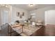 Open living room with modern furniture and hardwood floors at 9454 Becker Ct, Orlando, FL 32827