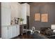 Stylish living room with a wet bar, wine refrigerator, and comfortable seating at 9454 Becker Ct, Orlando, FL 32827