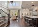 Open-concept living space with kitchen island, hardwood floors, and high ceilings at 9454 Becker Ct, Orlando, FL 32827