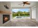 Outdoor living area featuring a stone fireplace with pool views at 9454 Becker Ct, Orlando, FL 32827