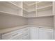 Well-organized pantry features custom shelving, storage cabinets and drawers at 9454 Becker Ct, Orlando, FL 32827