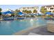 Community pool featuring lounge chairs and cabanas, perfect for relaxation at 9454 Becker Ct, Orlando, FL 32827