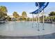 Community pool with playful fountains and ample seating surrounded by tropical landscaping at 9454 Becker Ct, Orlando, FL 32827