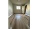 A bedroom featuring gray walls and light-colored laminate floors at 946 Lake Destiny Rd # D, Altamonte Springs, FL 32714