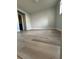 A bedroom featuring gray walls and light-colored laminate floors at 946 Lake Destiny Rd # D, Altamonte Springs, FL 32714