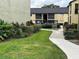 Manicured walkway leading between buildings, surrounded by lush landscaping at 946 Lake Destiny Rd # D, Altamonte Springs, FL 32714