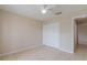 Bedroom features tile flooring, a ceiling fan, a closet, and a window at 2284 Cobblefield Cir, Apopka, FL 32703