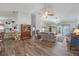 Expansive living room featuring seamless integration of a dining area, living room, and modern kitchen at 10320 Bumblebee Ln, Leesburg, FL 34788
