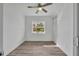 Well-lit room featuring light walls, wood-look floors, and a window with view at 1161 Ramble Ave, Deltona, FL 32725