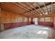 Unfinished basement with concrete floor, block walls, and exposed wood ceiling at 1343 Spring Lake Rd, Fruitland Park, FL 34731