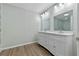 Bathroom featuring a double sink vanity and modern lighting at 1343 Spring Lake Rd, Fruitland Park, FL 34731