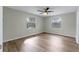 Bedroom with a ceiling fan and wood-look floors at 1343 Spring Lake Rd, Fruitland Park, FL 34731