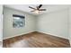 Bedroom with a ceiling fan and wood-look floors at 1343 Spring Lake Rd, Fruitland Park, FL 34731