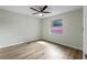 Bedroom featuring a ceiling fan, wood floor, and window at 1343 Spring Lake Rd, Fruitland Park, FL 34731