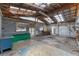 Unfinished garage with work benches, open ceiling, and lots of potential at 1343 Spring Lake Rd, Fruitland Park, FL 34731