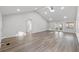Bright living room with vaulted ceilings, skylight, recessed lighting, and modern flooring at 1343 Spring Lake Rd, Fruitland Park, FL 34731