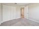 Bedroom with a double-door closet, connecting doorway, and neutral carpeting at 1412 Captiva Cv, Sanford, FL 32771