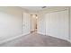 Bedroom with neutral carpet, an open doorway, and a double door closet at 1412 Captiva Cv, Sanford, FL 32771