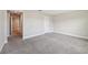 Spacious bedroom with plush carpeting, neutral walls, and doorways leading to other areas at 1412 Captiva Cv, Sanford, FL 32771