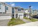 Inviting townhome showcasing modern architecture and a well-manicured lawn for an appealing curb appeal at 1412 Captiva Cv, Sanford, FL 32771
