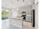 Bright kitchen with stainless steel appliances, modern cabinets, and granite countertops, seamlessly blending style and functionality at 1412 Captiva Cv, Sanford, FL 32771