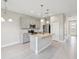 Modern kitchen with granite countertops, stainless steel appliances, and an island, ideal for cooking and entertaining at 1412 Captiva Cv, Sanford, FL 32771