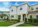 Well-maintained two-story home with lush lawn, neat landscaping, and inviting front entrance at 157 Primrose Dr, Davenport, FL 33837