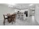 Open-concept kitchen with breakfast bar, dining table, and adjacent living area, perfect for entertaining at 157 Primrose Dr, Davenport, FL 33837