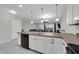 Open-concept kitchen with a view of the dining and living areas, perfect for entertaining and Gathering time at 157 Primrose Dr, Davenport, FL 33837