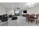 Spacious living area with tile flooring, comfortable seating, and sliding glass doors to patio at 157 Primrose Dr, Davenport, FL 33837
