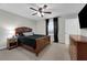 Cozy bedroom featuring a ceiling fan, large windows, and a spacious dresser at 157 Primrose Dr, Davenport, FL 33837