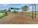 A view of the community playground with swings and slide at 157 Primrose Dr, Davenport, FL 33837