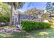 The back of the home features a large screened porch and well maintained landscaping at 1821 Myrtle Lake Hills Rd, Longwood, FL 32750