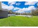 Manicured backyard with basketball court, and privacy fence at 1965 3Rd Dr, Sanford, FL 32771