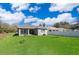 Spacious backyard features lush green grass and privacy fence at 1965 3Rd Dr, Sanford, FL 32771