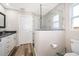 This bathroom features granite counters, tiled shower, and white cabinets at 1965 3Rd Dr, Sanford, FL 32771