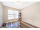 This bedroom features new wood-look flooring and a bright window at 1965 3Rd Dr, Sanford, FL 32771