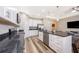 Modern kitchen featuring stainless steel appliances, granite countertops, and white cabinets at 1965 3Rd Dr, Sanford, FL 32771