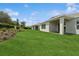Beautiful backyard with lush lawn and a covered patio at 2120 Antilles Club Dr # 10, Kissimmee, FL 34747