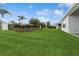 The home features a large backyard with manicured landscaping at 2120 Antilles Club Dr # 10, Kissimmee, FL 34747